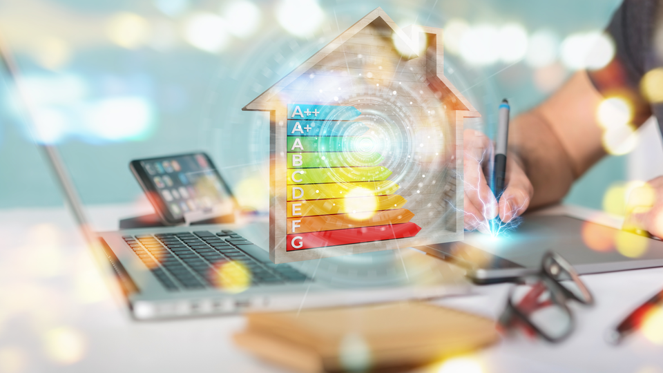 Graphic designer on blurred background using 3D rendering energy rating chart in a wooden house
